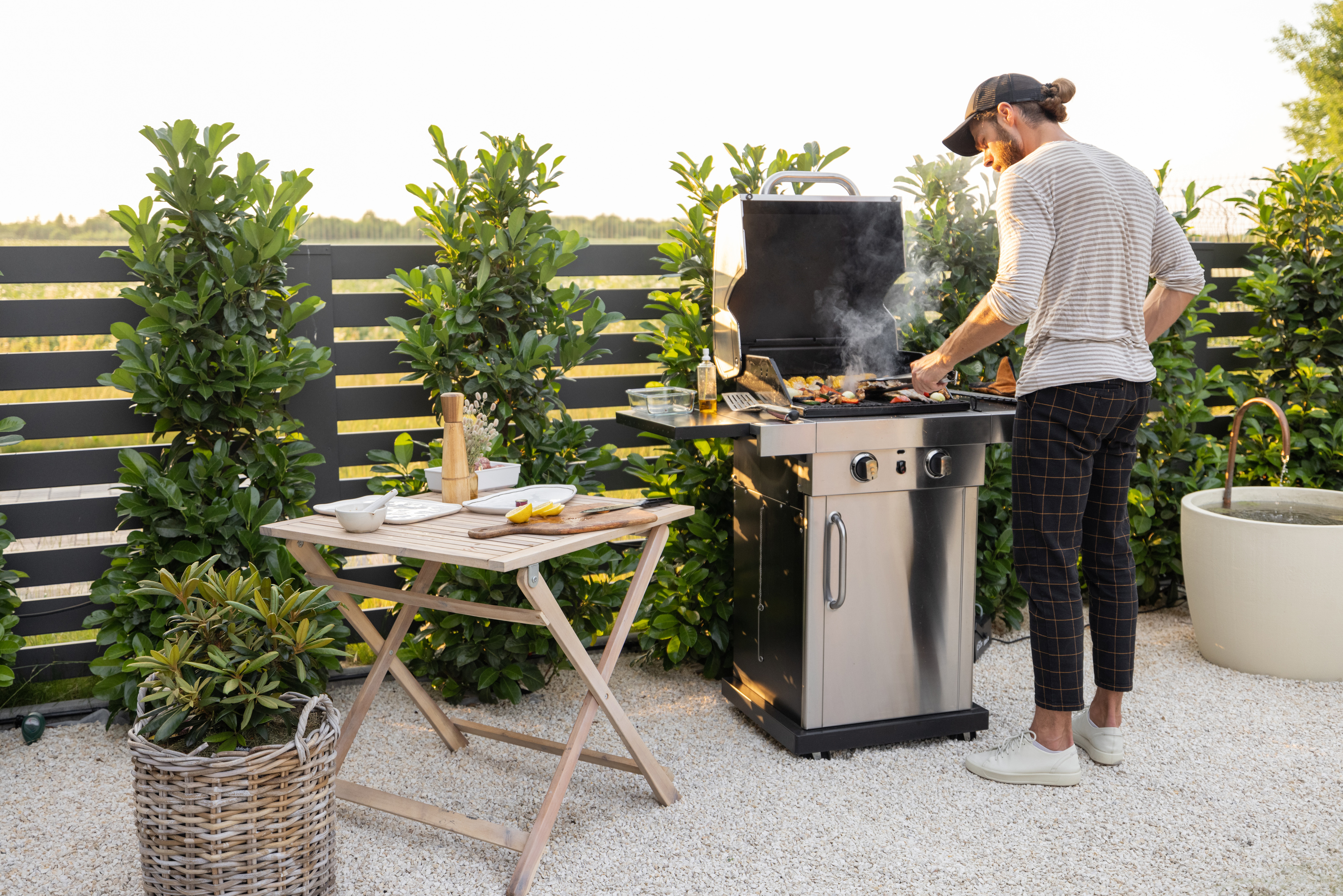 Man Cooking on a Grill Outdoors